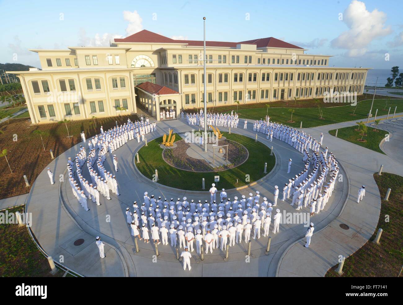U.S. sailors from Naval Hospital Guam prepare for their annual dress whites inspection November 13, 2015 in Agana Heights, Guam. Due to the tropical climate the sailors based in Guam wear the dress white uniform all year instead of switching to the winter blue uniform. Stock Photo