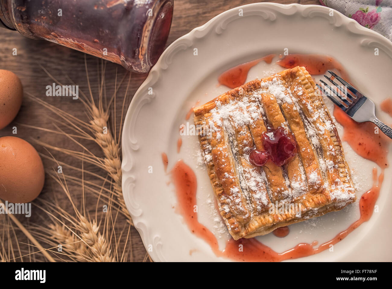 Homemade cherry pie on rustic background Stock Photo