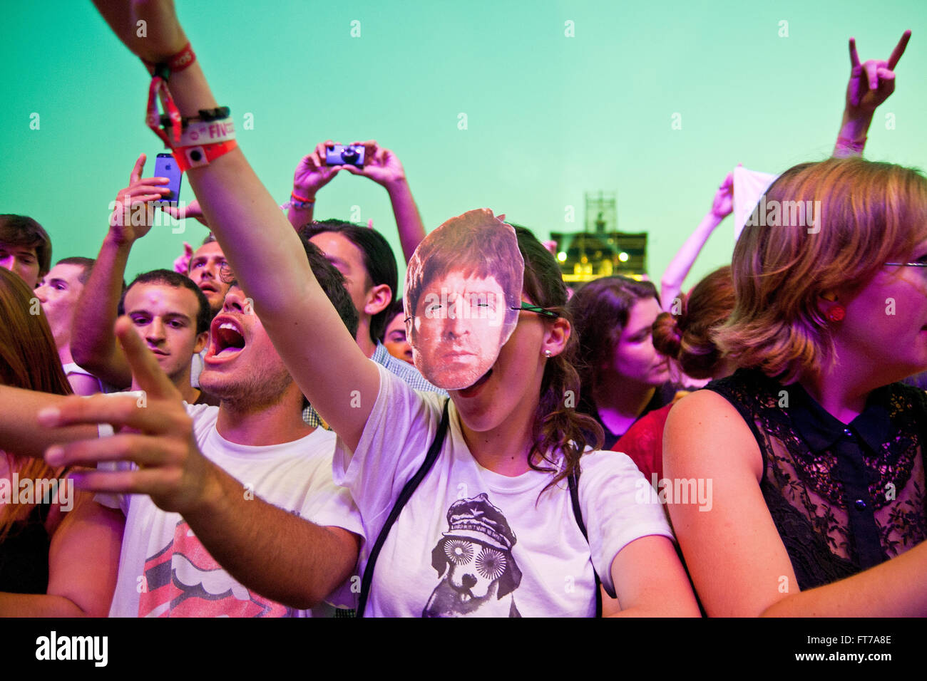 BENICASSIM, SPAIN - JULY 19: A woman from the crowd with a mask of Noel Gallagher (Oasis) at FIB. Stock Photo