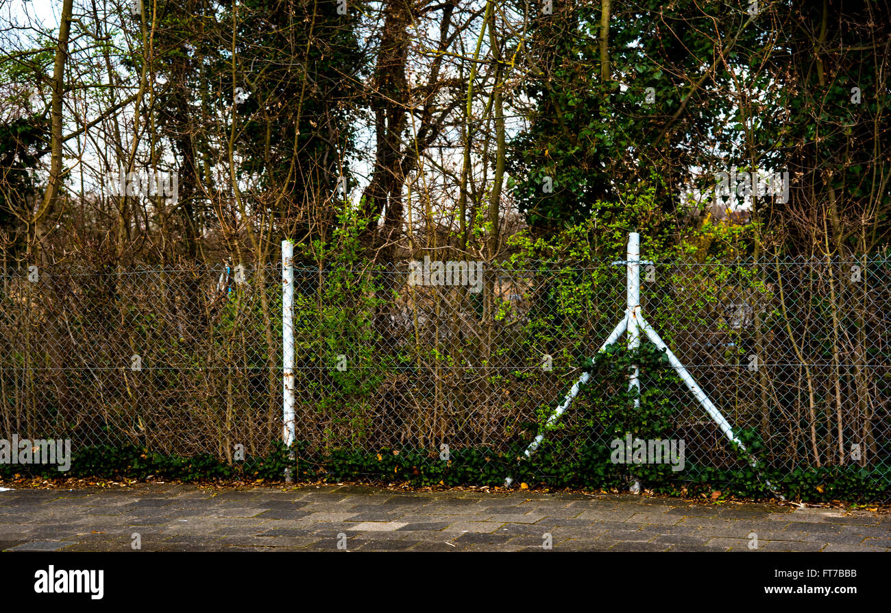 Park behind gray fence Stock Photo - Alamy