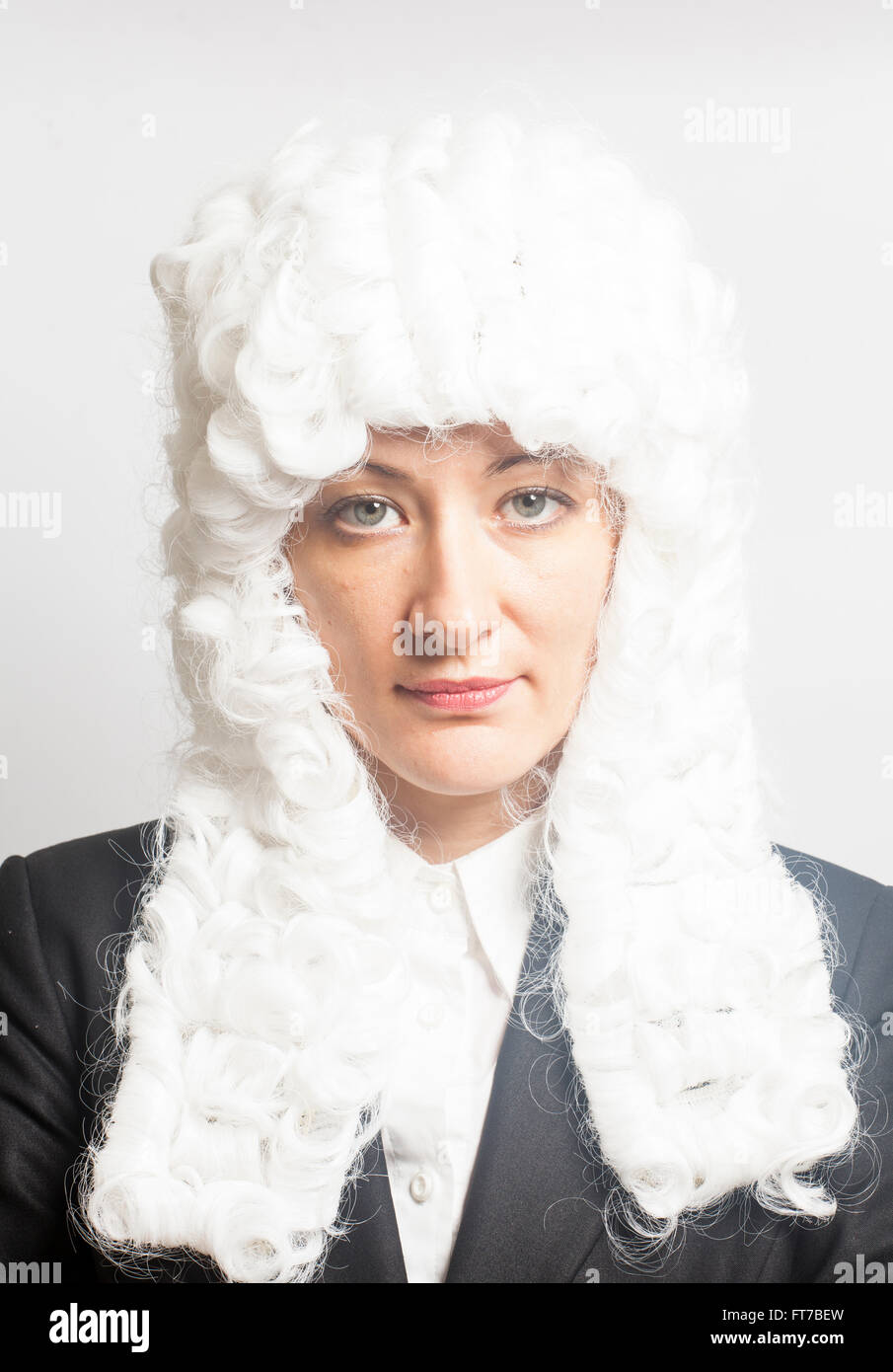 Female judge wearing a wig on white Stock Photo Alamy