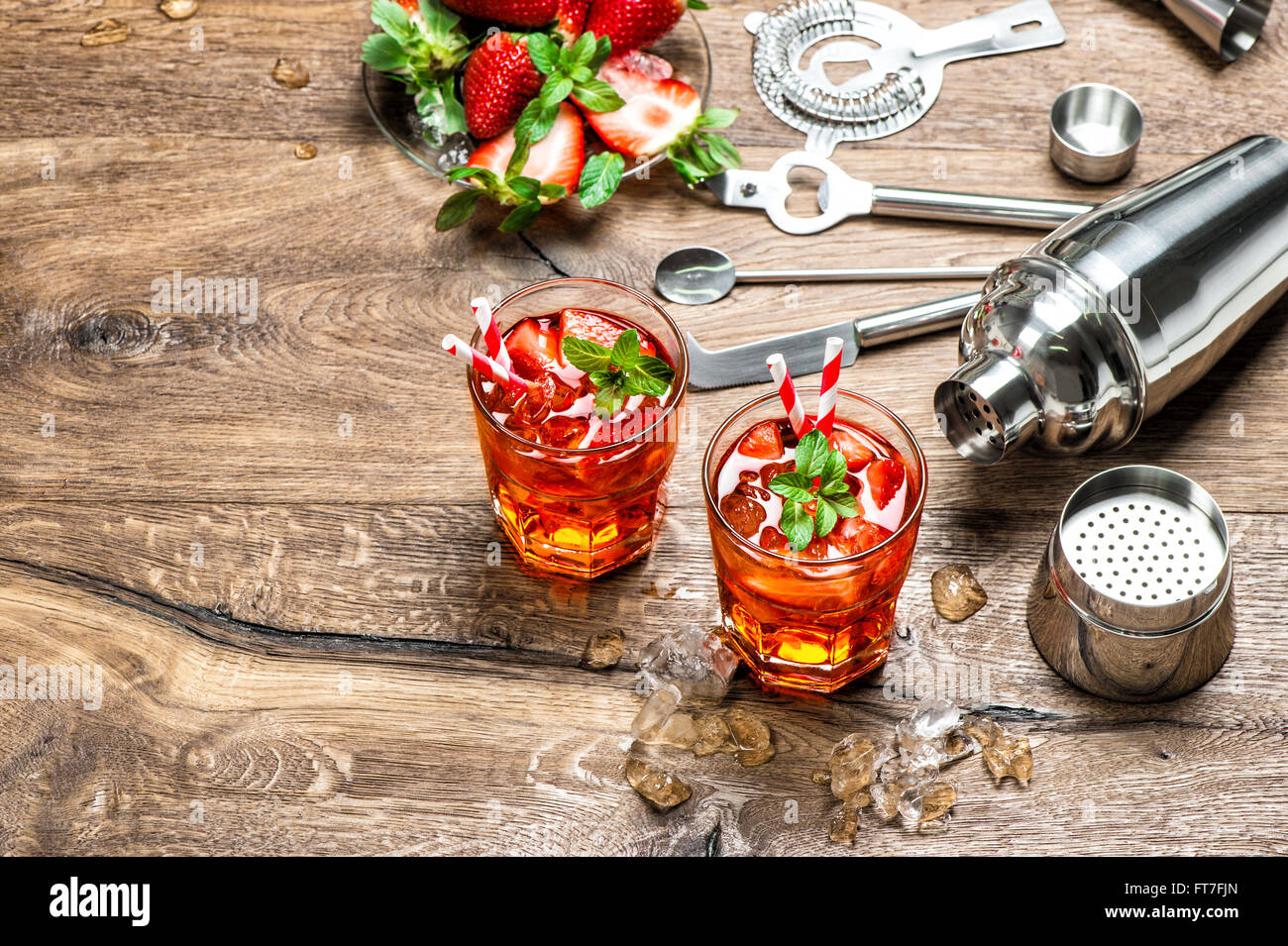 Red drink with ice. Cocktail making bar tools and shaker Stock Photo