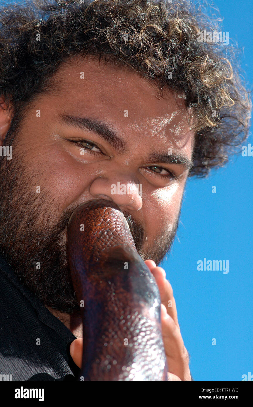 Aboriginal man playing a didgeridoo hires stock photography and images