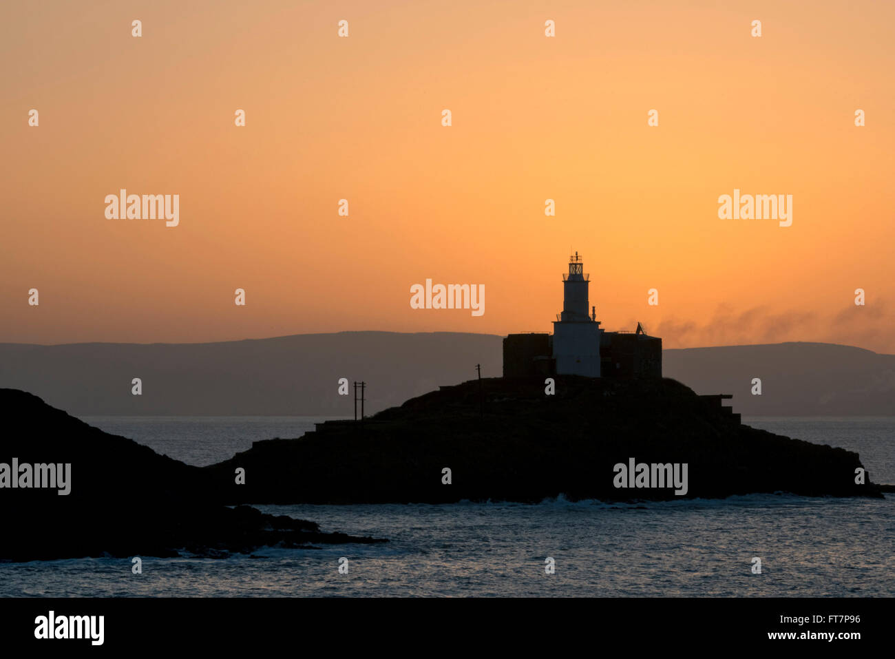Just before sunrise at Mumbles lighthouse, Bracelet Bay, Wales, UK. Stock Photo