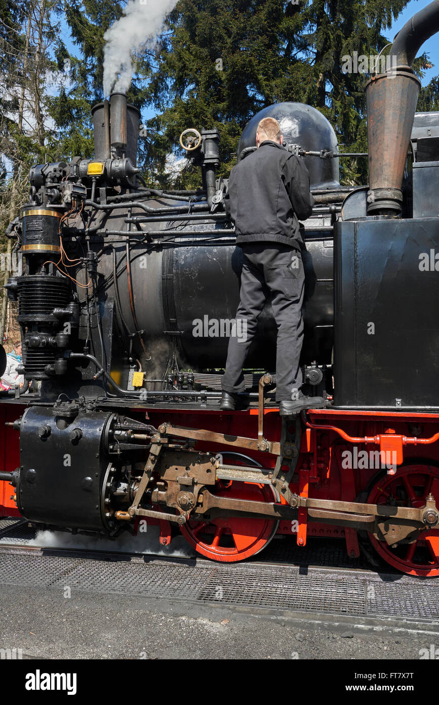 Steam engine of the Harzer narrow gauge railway getting service in station  Drei Annen Hohne, Harz Germany Stock Photo