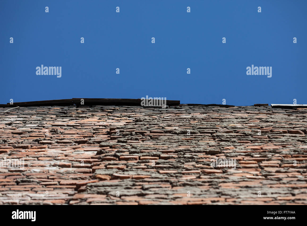 perspective of old red brick wall and blue sky Stock Photo