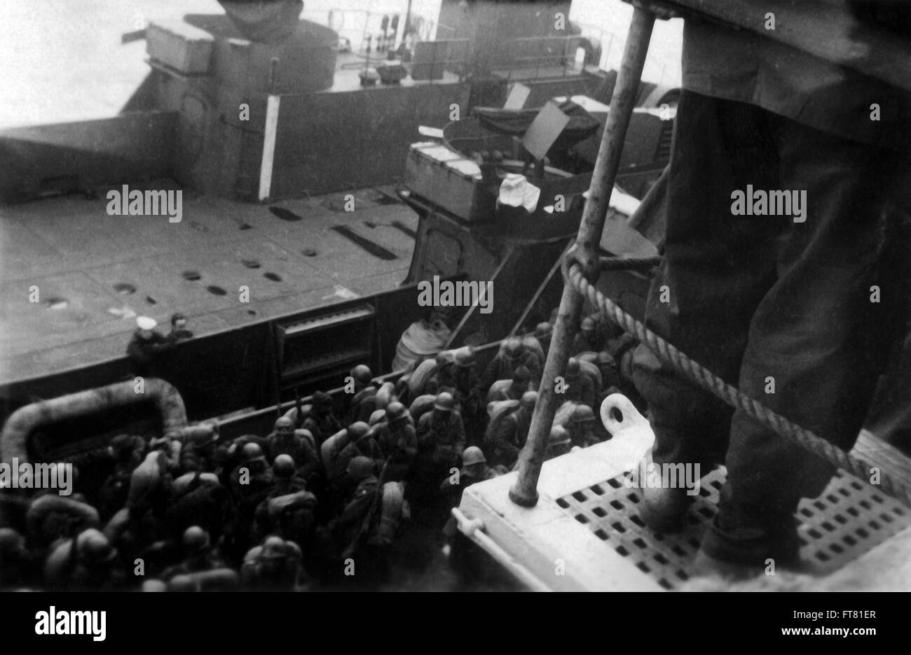 Troops disembarking from ship to landing craft in France 1944 Stock Photo