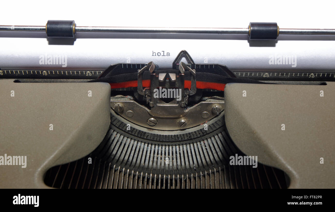 HOLA (Hello in Spanish language). Message written on old typewriter on