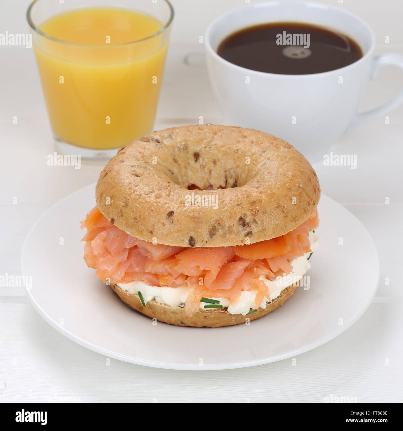 Bagel for breakfast with salmon fish, cream cheese, orange juice and coffee  Stock Photo - Alamy