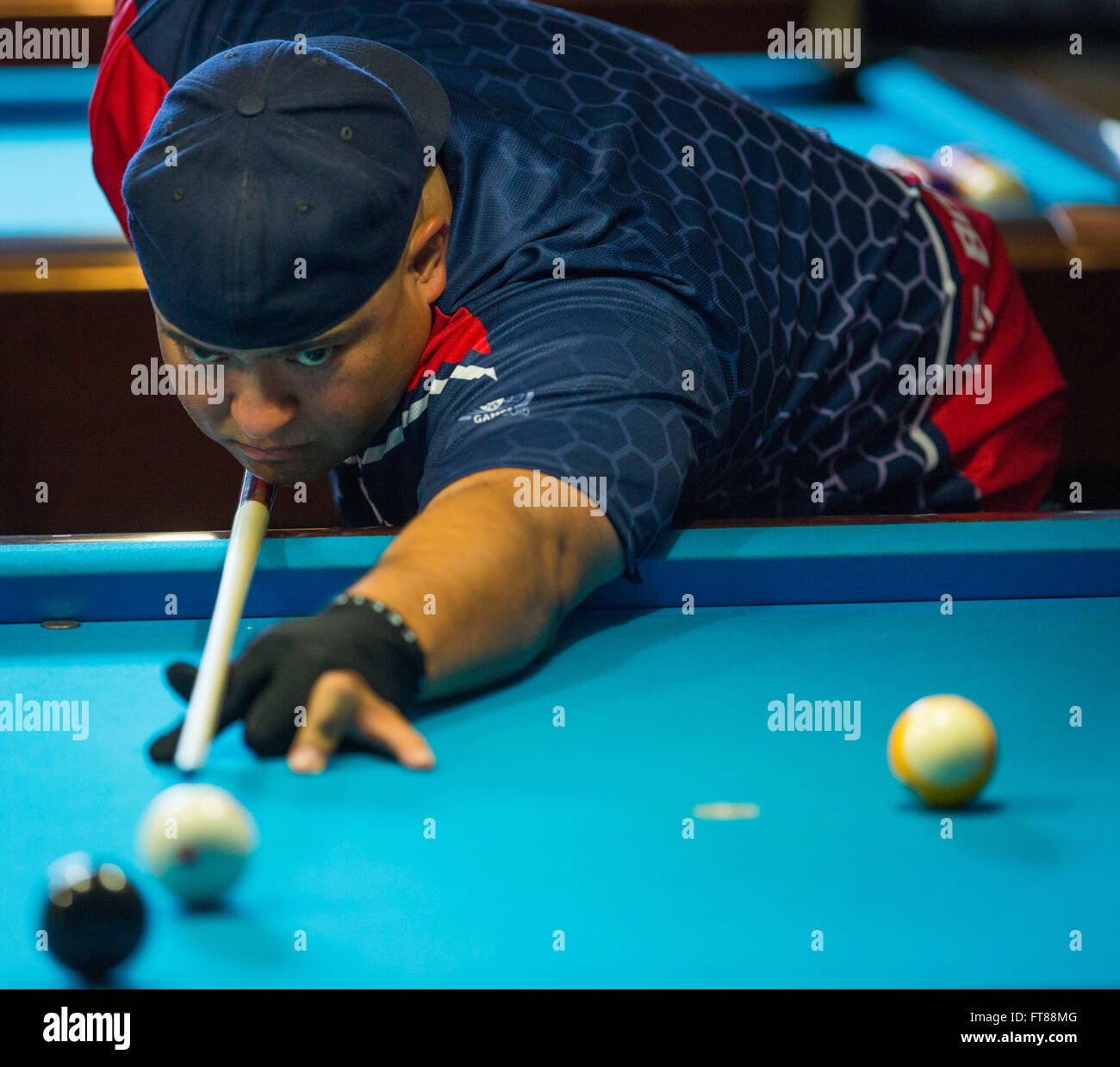 Border Patrol Agent James Garcia participates in the Pocket Billiards Tournament held at the