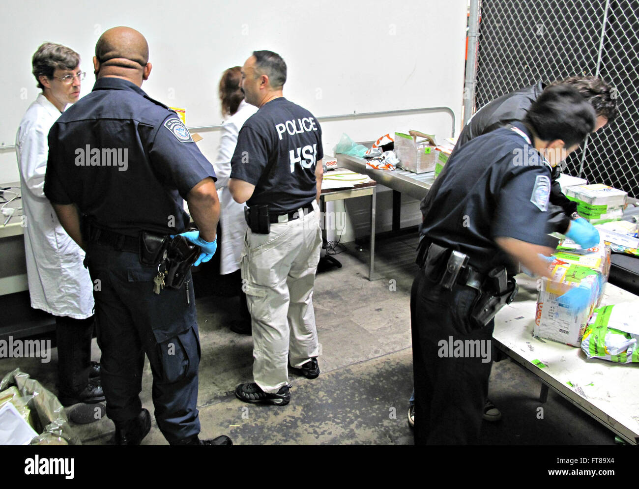 Synergy III – CBP officers, CBP chemists, HSI agents, and DEA investigators working as a team in  detecting, synthetic drugs arriving from China during Project Synergy III at an express consignment facility in Los Angeles.   Photo by: Jaime Ruiz Stock Photo