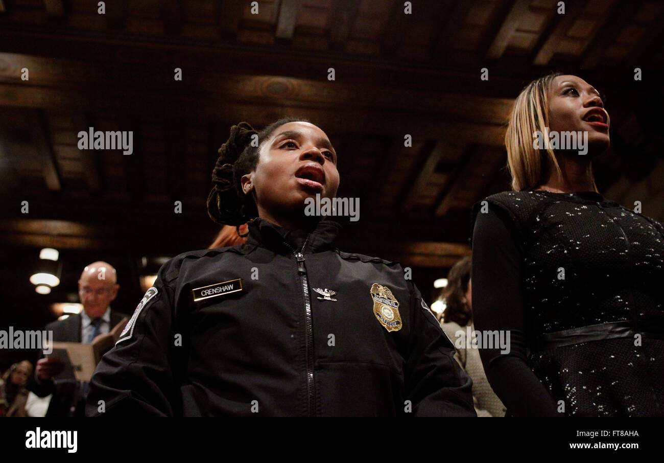 U.S. Customs and Border Protection Officer Samara Crenshaw sings the Negro National Anthem with the audience at the conclusion of he Federal Triangle Partnership's celebration of Black History Month in the Dept. of Commerce auditorium Feb. 24, 2016. (CBP Photo by Glenn Fawcett) Stock Photo