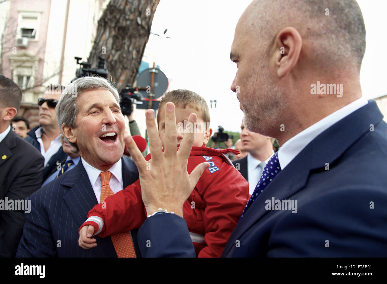 U.S. Secretary of State John Kerry laughs as Albanian Prime Minister Edi Rama tells him the age of a five-year-old child he plucked from the crowd outside the Prime Ministry in Tirana, Albania, following their bilateral meeting on February 14, 2016. [State Department photo/ Public Domain] Stock Photo