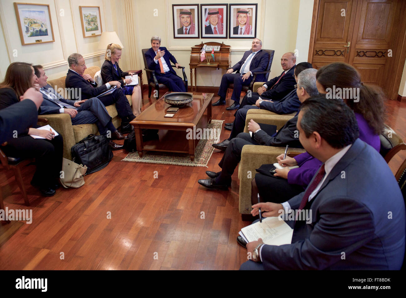 U.S. Secretary of State John Kerry and Jordanian Foreign Minister Nasser Judeh sit with their respective teams before a bilateral meeting on February 21, 2016, at the Jordanian Foreign Ministry of Foreign Affairs in Amman, Jordan. [State Department photo/ Public Domain] Stock Photo