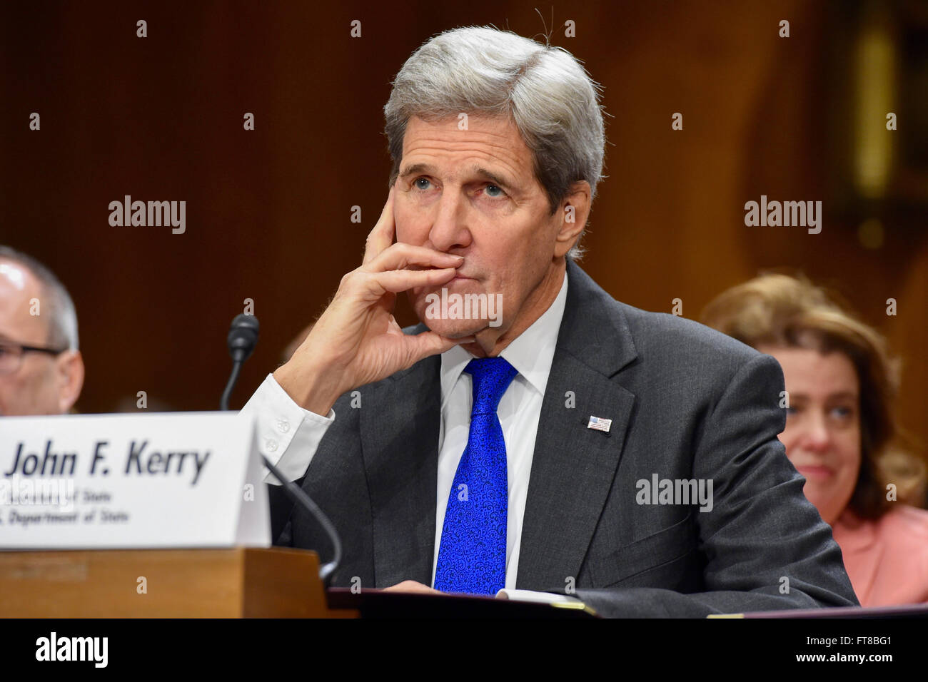 U.S. Secretary of State John Kerry listens to opening statements from the leaders of the Senate Foreign Relations Committee on February 23, 2016, during an appearance on Capitol Hill in Washington, D.C., to discuss the Obama Administration's 2017 federal budget request. [State Department photo/ Public Domain] Stock Photo