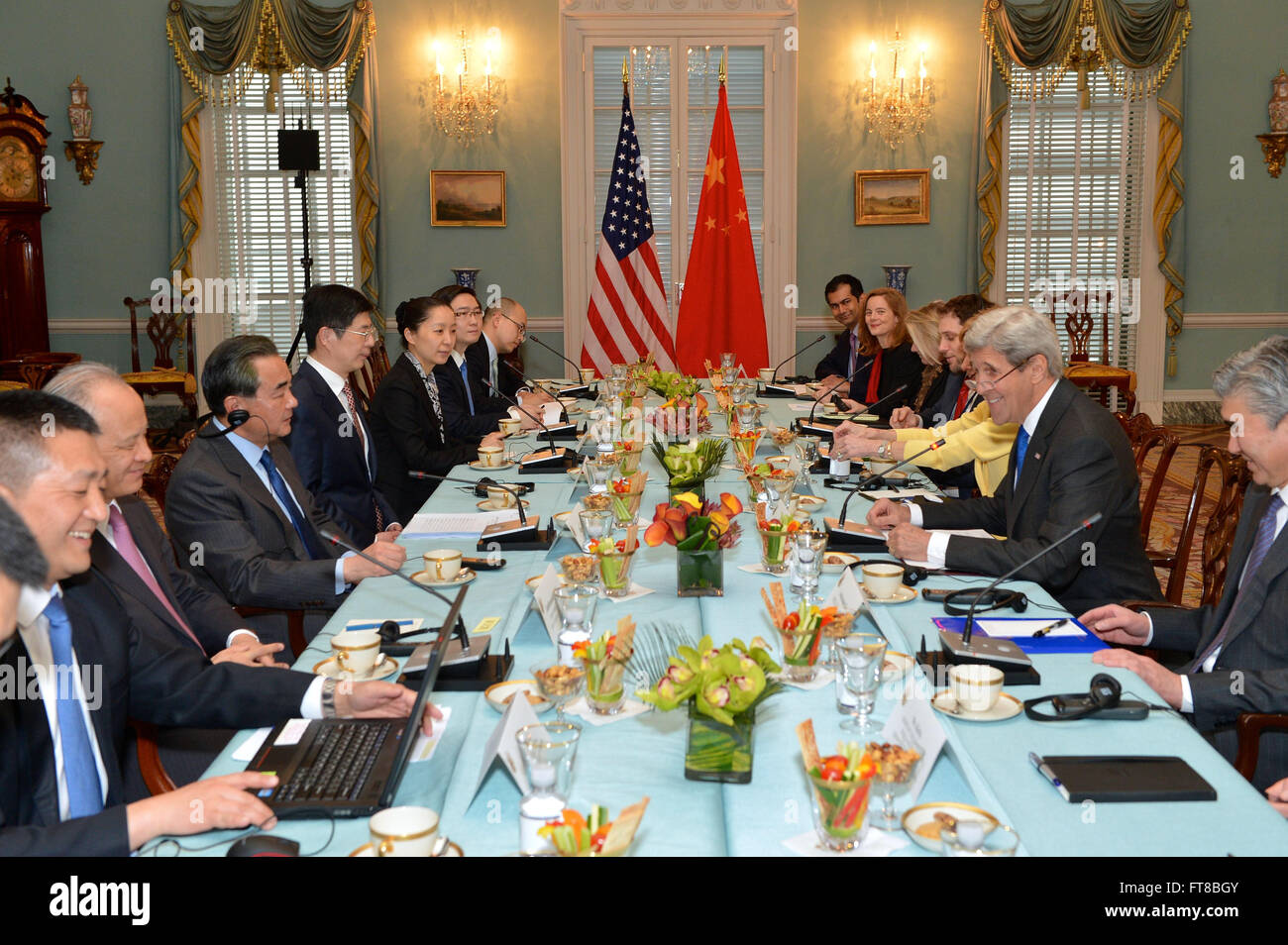 U.S. Secretary of State John Kerry, with Ambassador Sung Kim, Special Representative for North Korea Policy, Kristie Kenney, Counselor of the Department, and Chief of Staff Jon Finer, shares a laugh with Chinese Foreign Minister Wang Yi and his delegation during their bilateral meeting at the U.S. Department of State in Washington, D.C., on February 23, 2016. [State Department photo/ Public Domain] Stock Photo