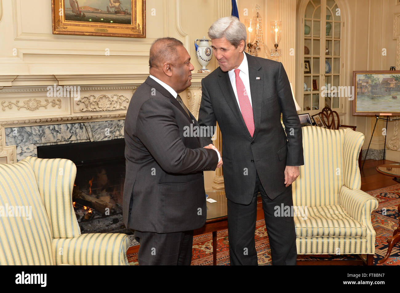 U.S. Secretary of State John Kerry shakes hands with Sri Lankan Foreign Minister Mangala Samaraweera after the counterparts addressed reporters at the U.S. Department of State in Washington, D.C., on February 25, 2016. [State Department photo/ Public Domain] Stock Photo