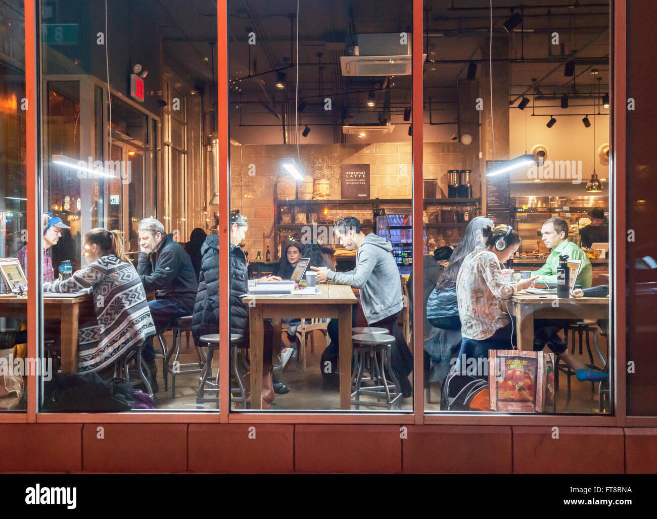 Customers take advantage of free wifi in the Bean & Bean Coffee shop