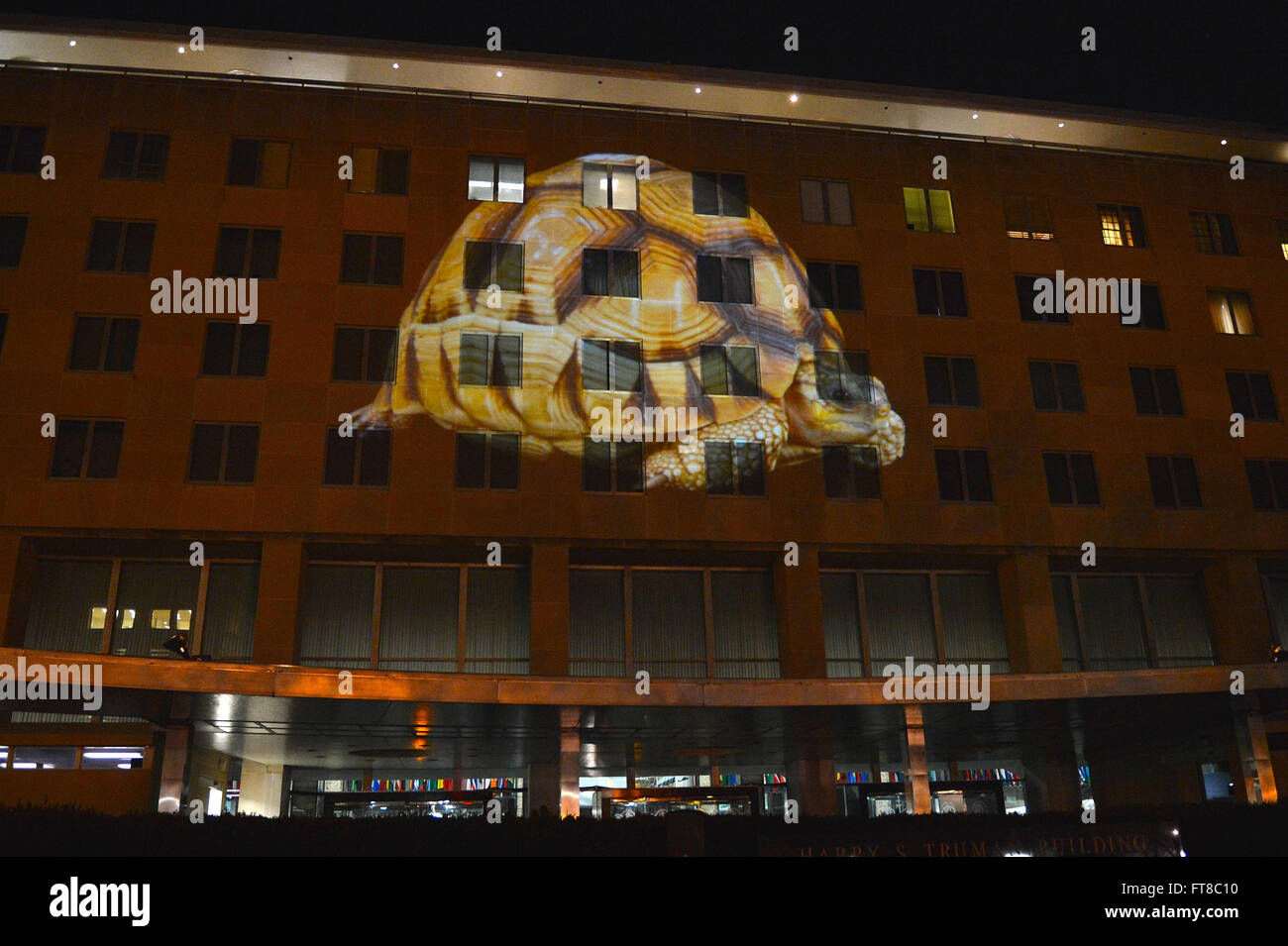 The U.S. Department of State, in partnership with Discovery Communications, Vulcan Productions, and the documentary film &quot;Racing Extinction,&quot; projects images of wildlife, including many threatened species, on the U.S. Department of State's C Street façade in Washington, D.C., on March 2, 2016. The goal is to raise awareness of, and spur action on the global threat of wildlife trafficking. [State Department photo/ Public Domain] Stock Photo