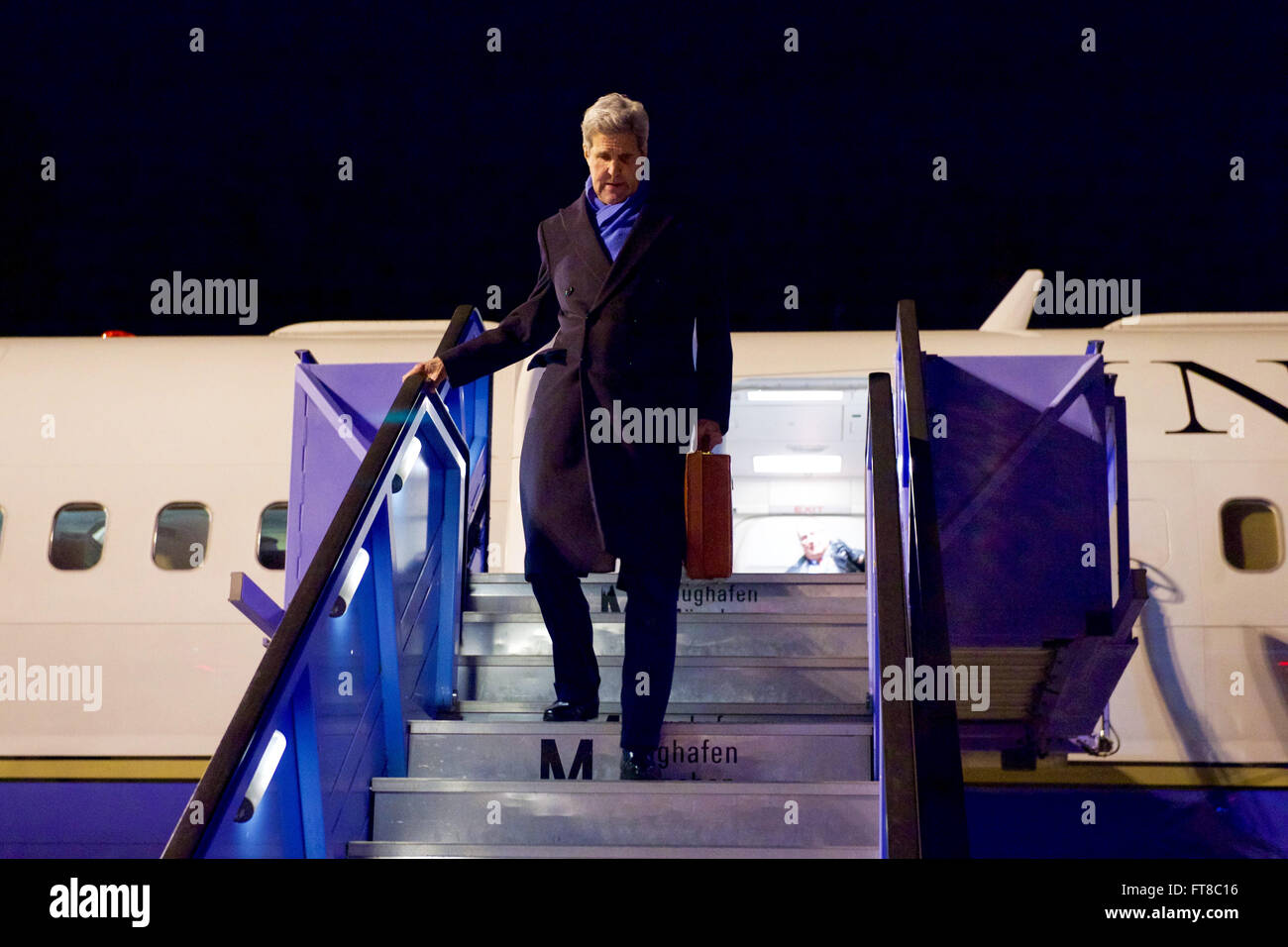 U.S. Secretary of State John Kerry disembarks from his airplane on February 10, 2016, after flying from Andrews Air Force Base in Camp Springs, Maryland, to Munich International Airport in Munich, Germany, so he can attend meetings focused on Syria and also address the Munich Security Conference. [State Department photo/ Public Domain] Stock Photo