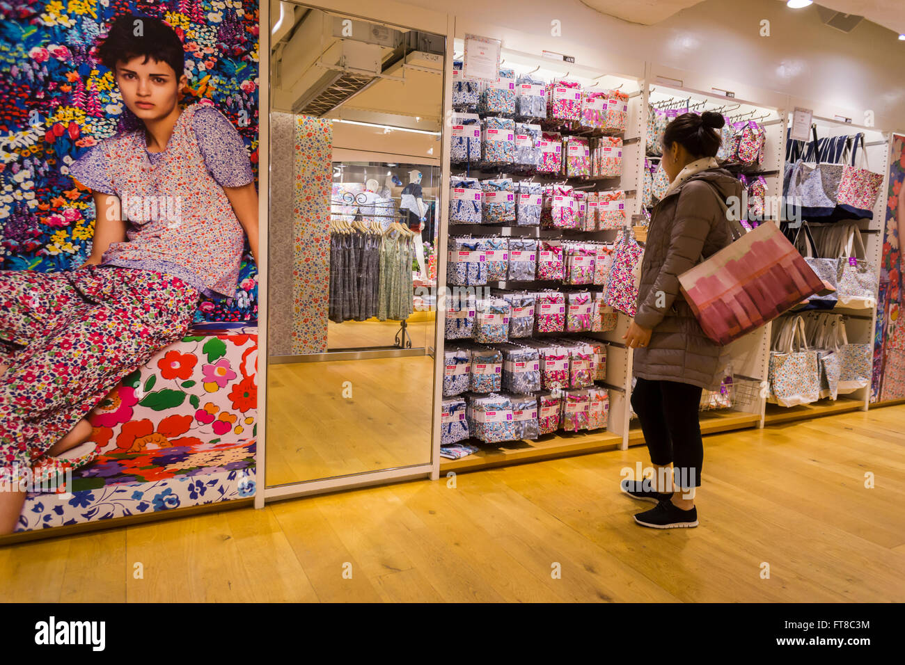 Shoppers in the Uniqlo store on Fifth Avenue in New York on Thursday, March  24, 2016 browse the merchandise in the collaboration between Uniqlo and  Liberty London, a company known mostly for