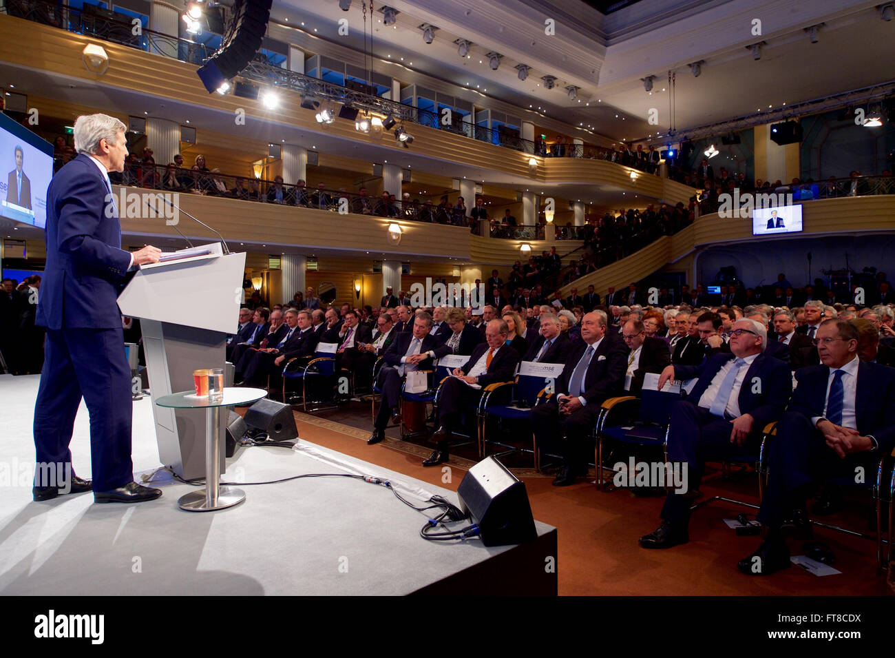 German Foreign Minister Frank-Walter Steinmeier and Russian Foreign Minister Sergey Lavrov (bottom right) look on as U.S. Secretary of State John Kerry addresses the Munich Security Conference on February 13, 2016, at the Bayerischer Hof Hotel in Munich, Germany. [State Department photo/ Public Domain] Stock Photo