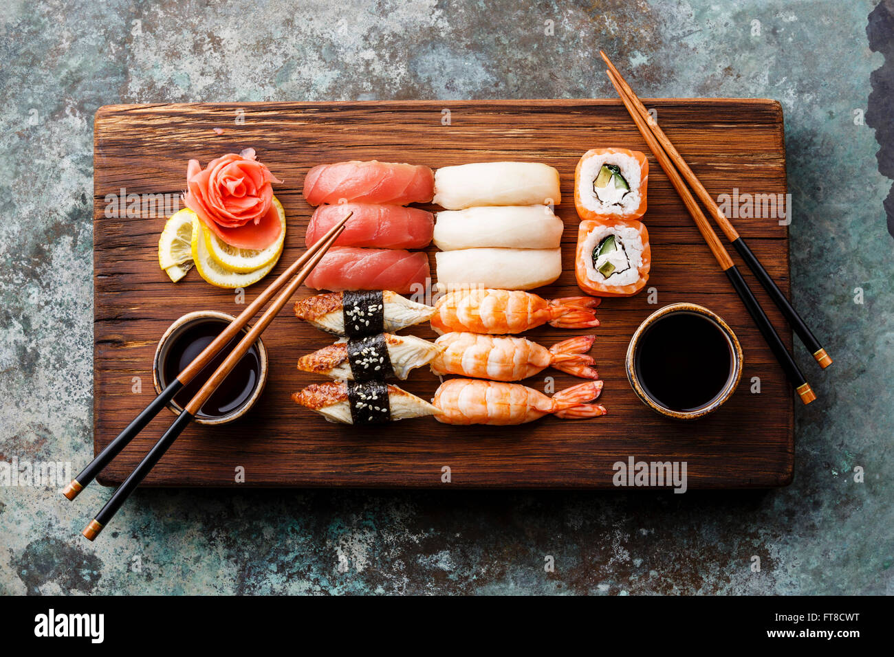 Sushi Set nigiri and sushi rolls served for two on wooden serving board block Stock Photo