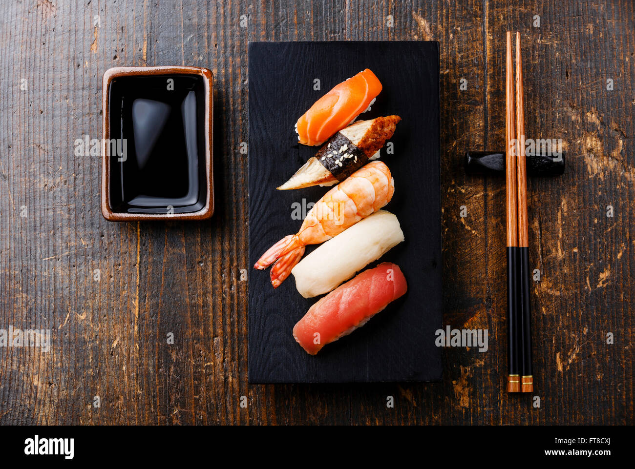 Nigiri sushi set and soy sauce on wooden table background Stock Photo