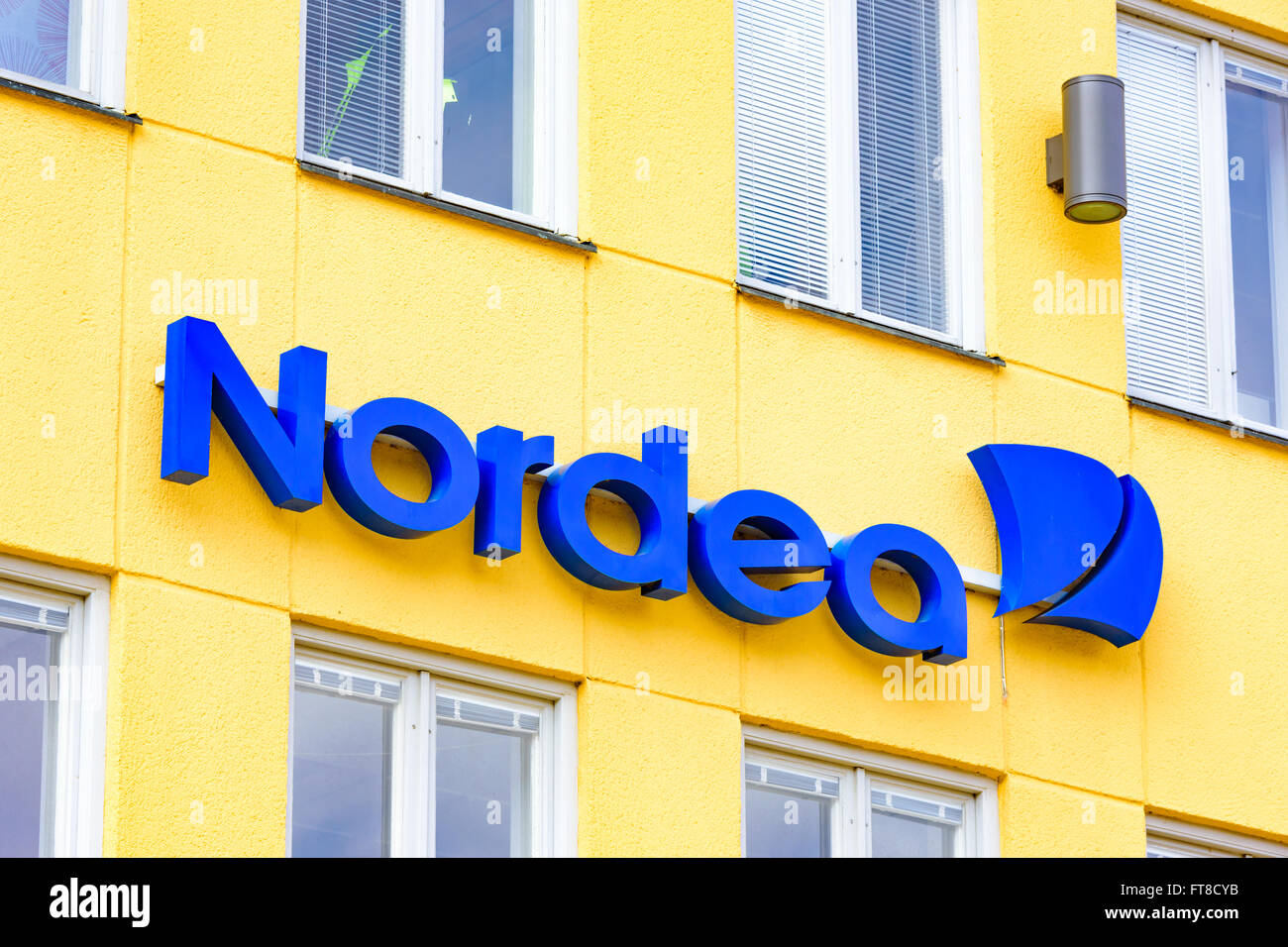 Kristianstad, Sweden - March 20, 2016: Nordea is one of the major banks in Sweden. Here is their logo found as a sign above a ba Stock Photo
