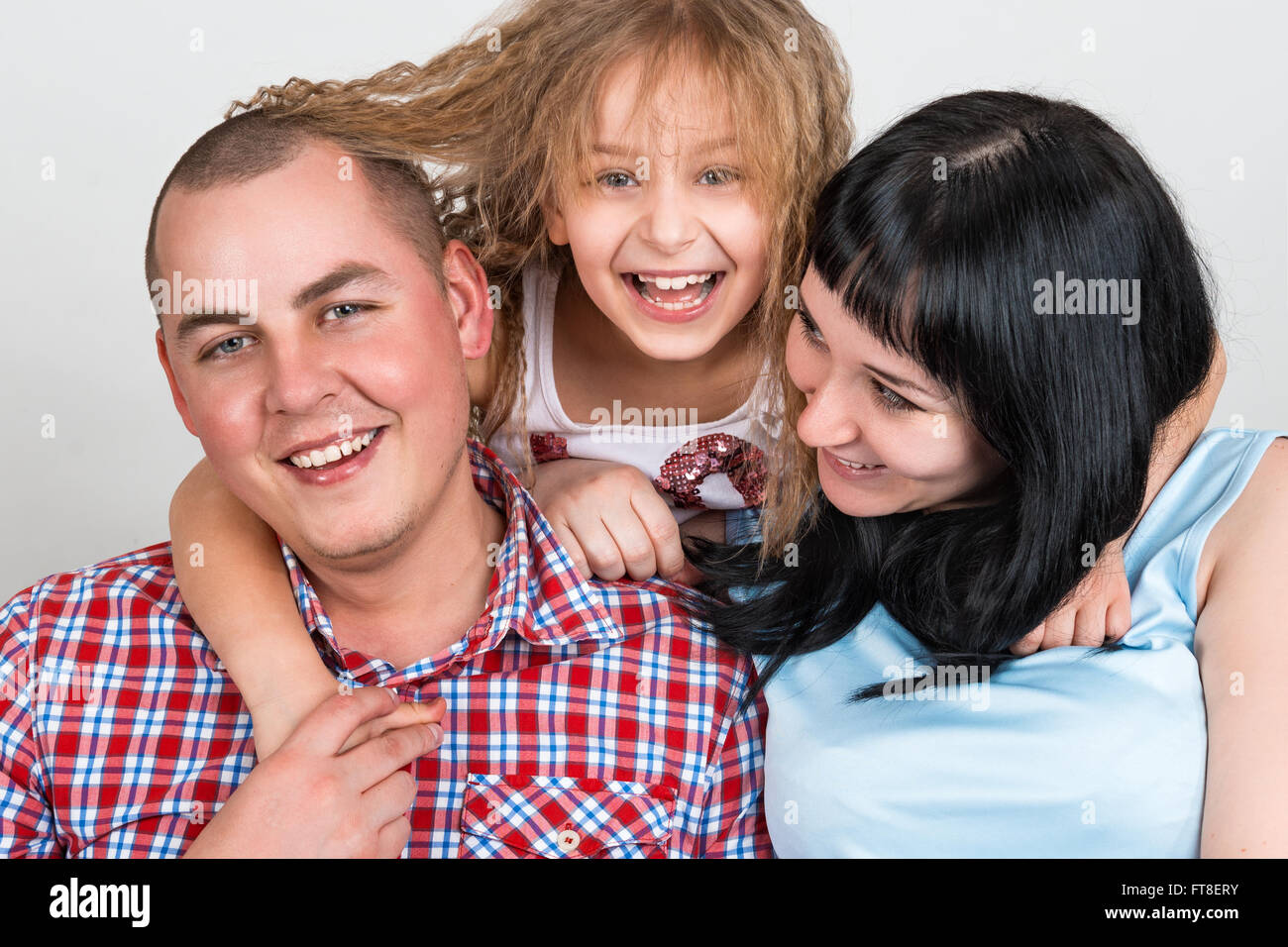 Portrait of a happy family on a gray background Stock Photo - Alamy