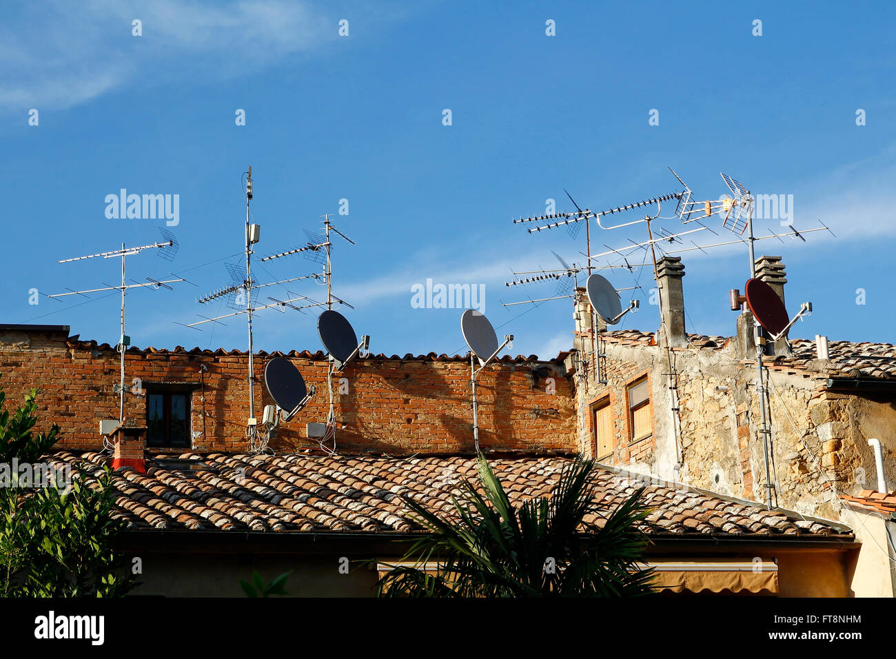 Television antennas in the roof tops Stock Photo