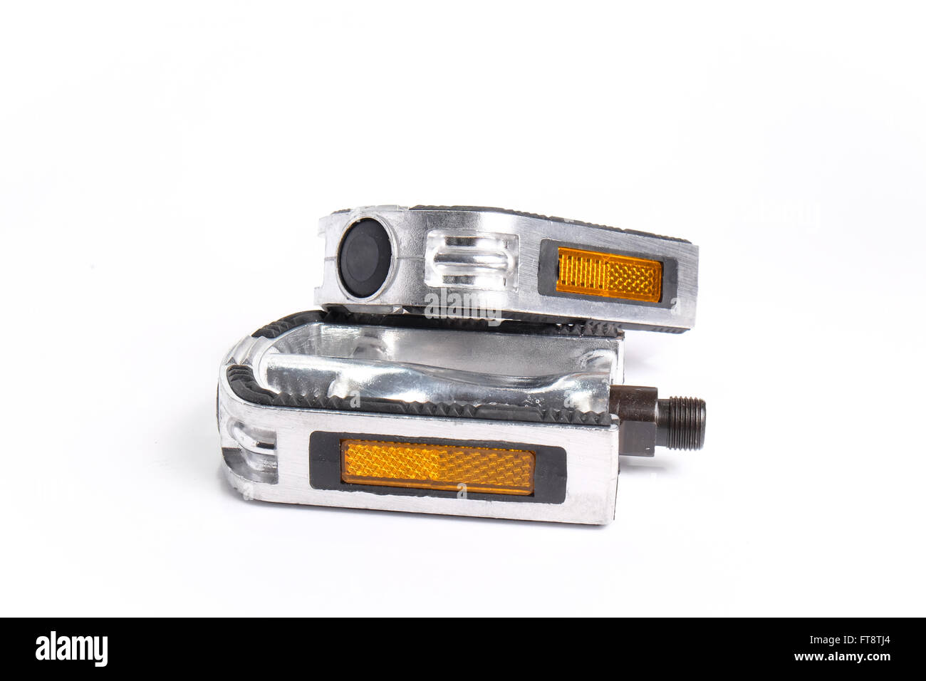 Two bicycle pedals of aluminum stacked on another Stock Photo