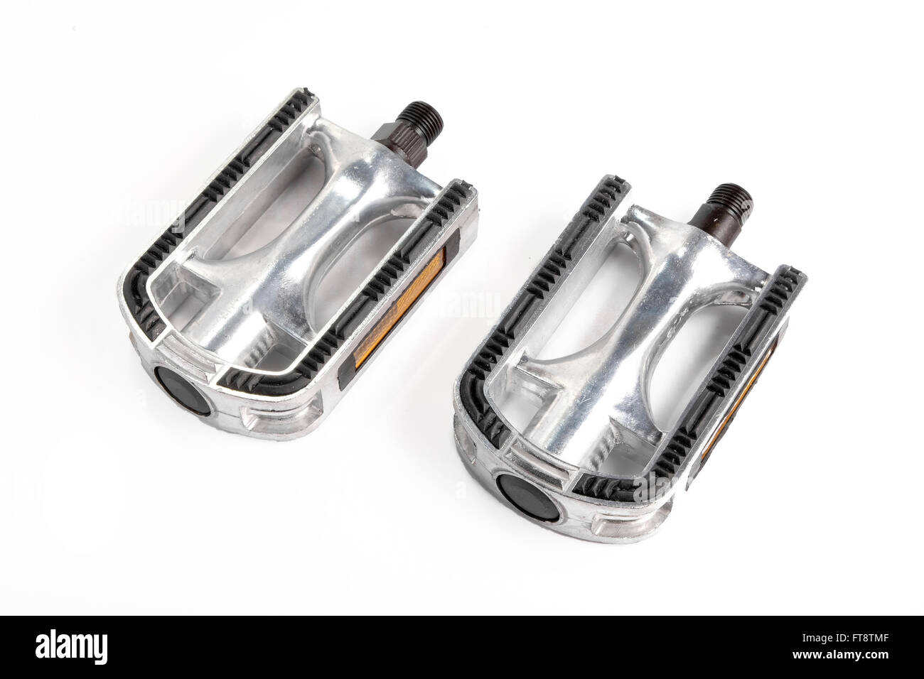 Two bicycle pedals of aluminum next to each other Stock Photo
