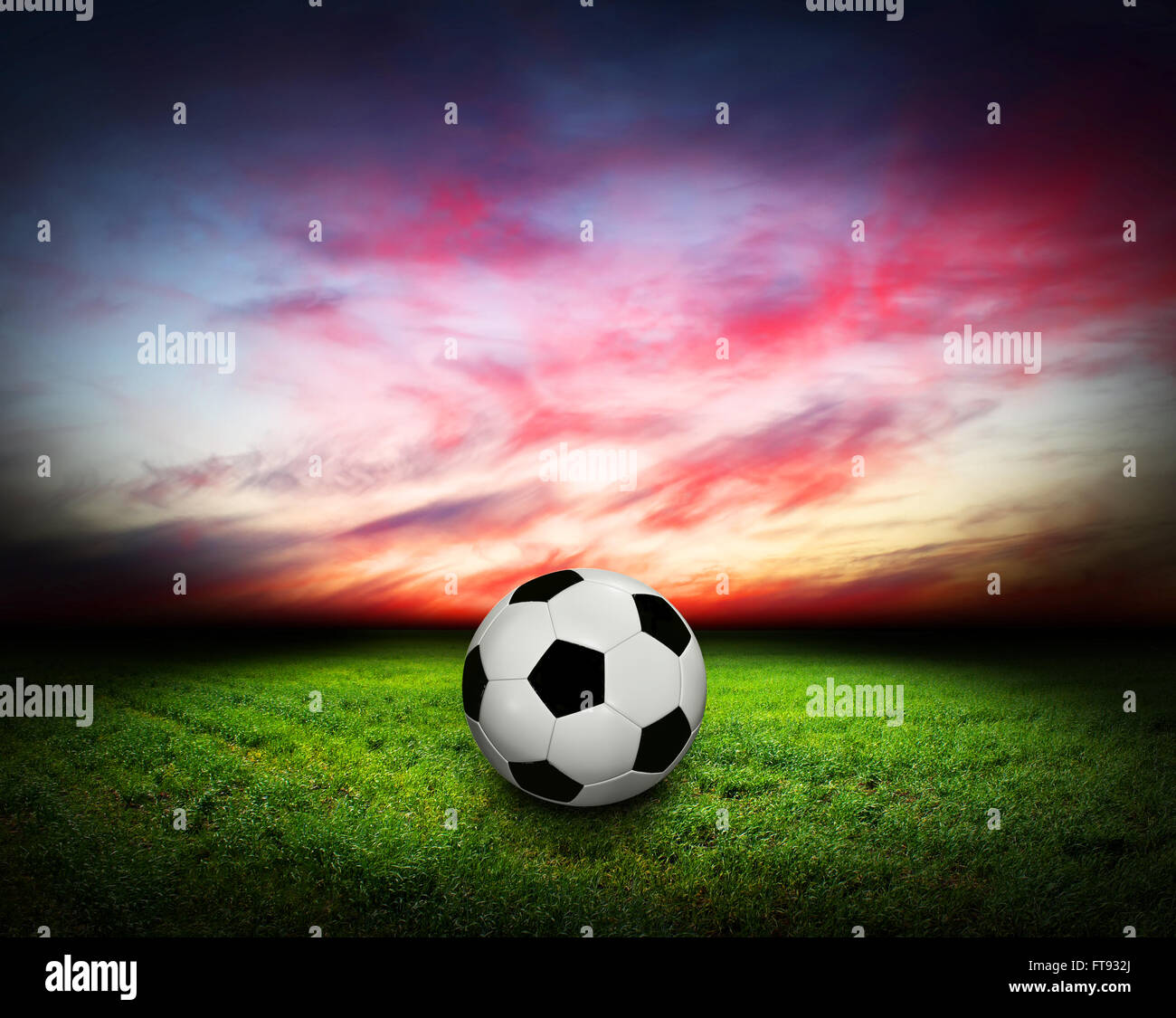 Soccer Ball on Grass sport, sky, clouds Stock Photo - Alamy