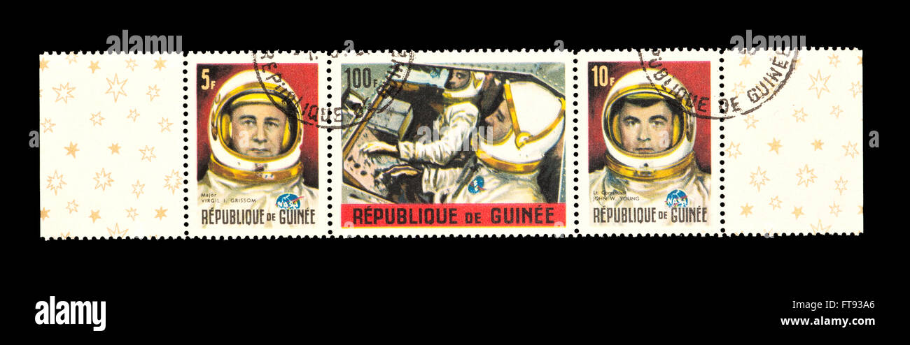 Postage stamps from GUinea depicting Major Virgil I. Grissom, Lt. Com. John W. Young, both in the Gemini 2 spaceship. Stock Photo