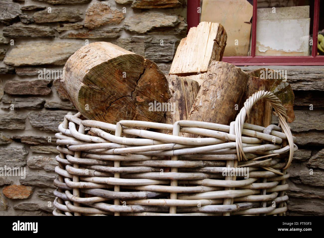 Firewood in basket in front of old house, Cardrona, Otago, South island,  New Zealand Stock Photo