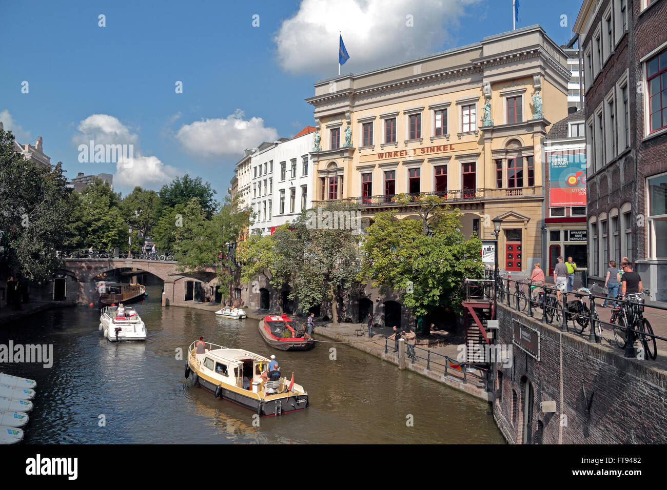 Boats cruising on a canal under Winkel van Sinkel, Oudegracht in Utrecht,  Netherlands Stock Photo - Alamy