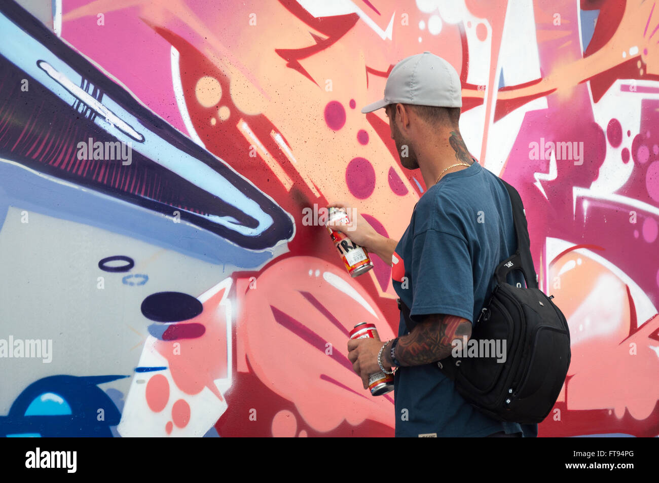 Artist painting graffiti Stock Photo Alamy