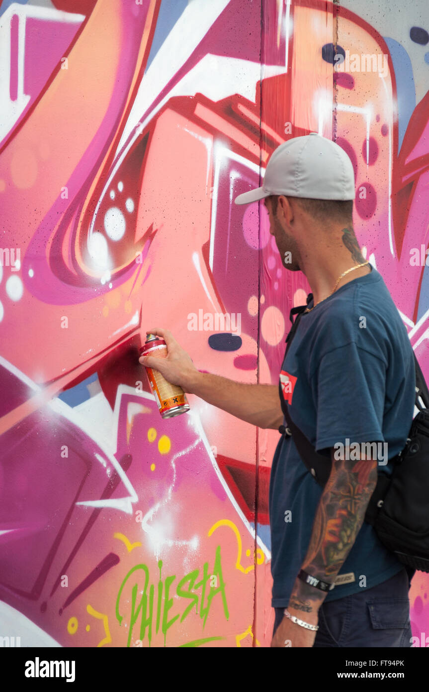 Artist painting graffiti Stock Photo