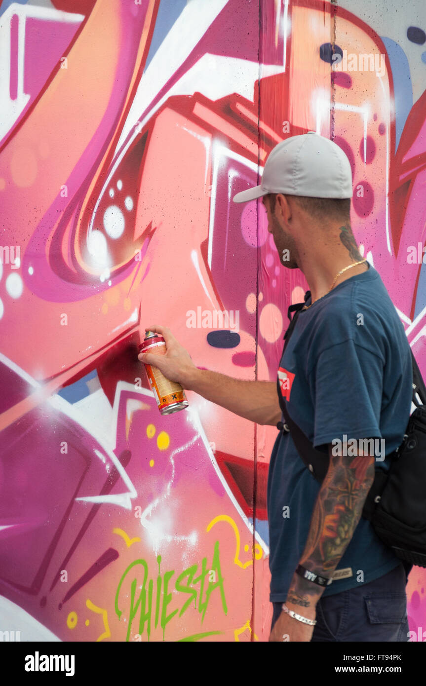 Artist painting graffiti Stock Photo Alamy