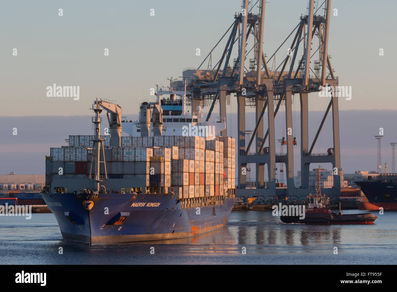 Maersk Nijmegen maneuvers in the Container Terminal East at the Post of Aarhus. Stock Photo
