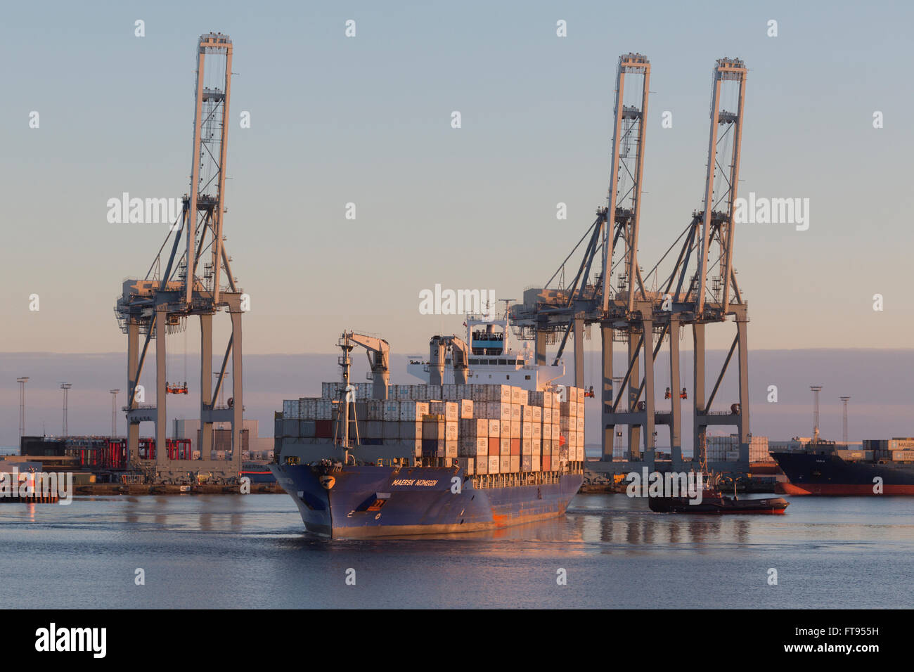 Maersk Nijmegen maneuvers in the Container Terminal East at the Post of Aarhus. Stock Photo