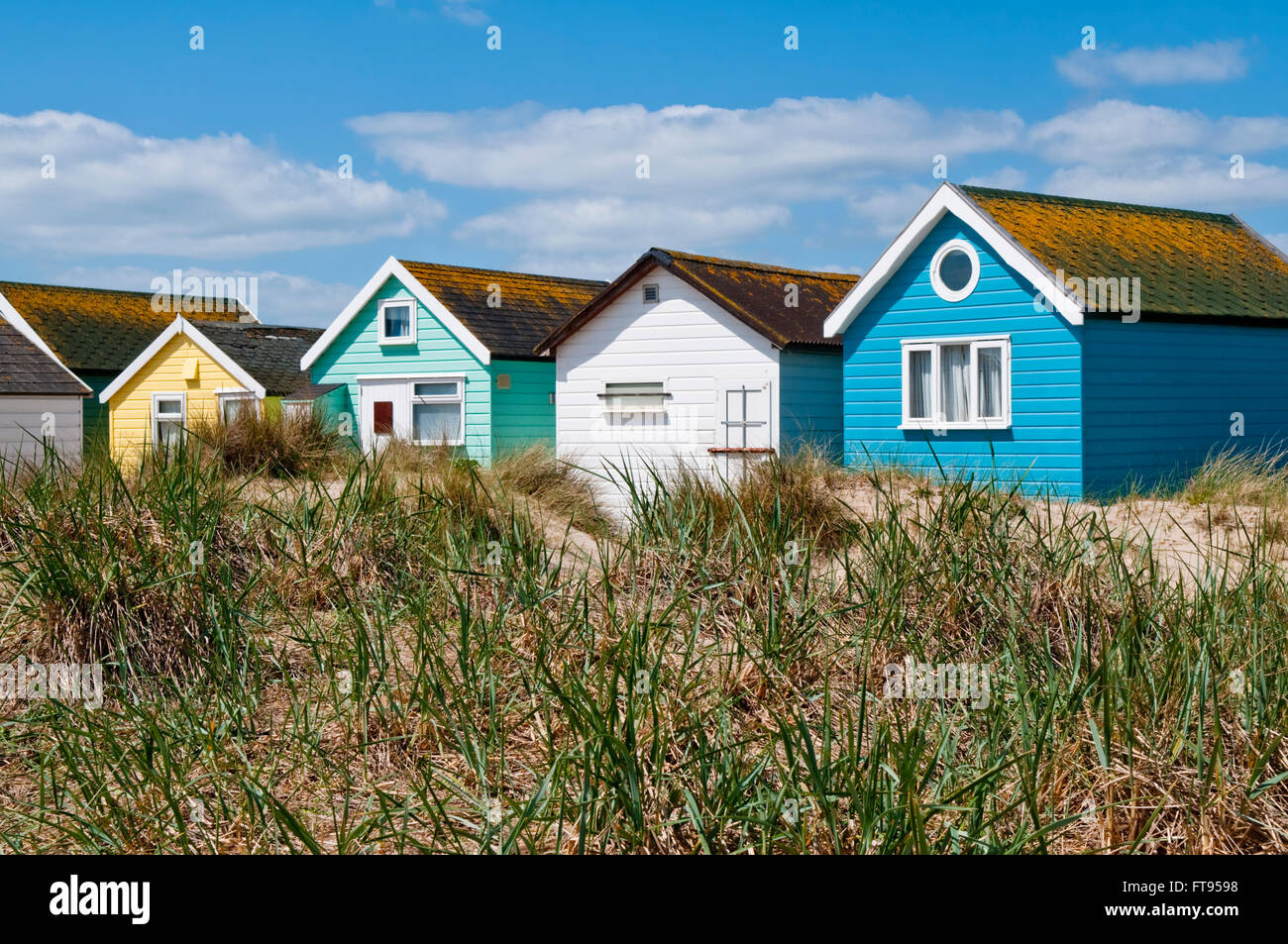 Beach huts in the sand dunes at Mudeford Sandbank, Hengistbury Head, near Christchurch, Dorset, UK Stock Photo