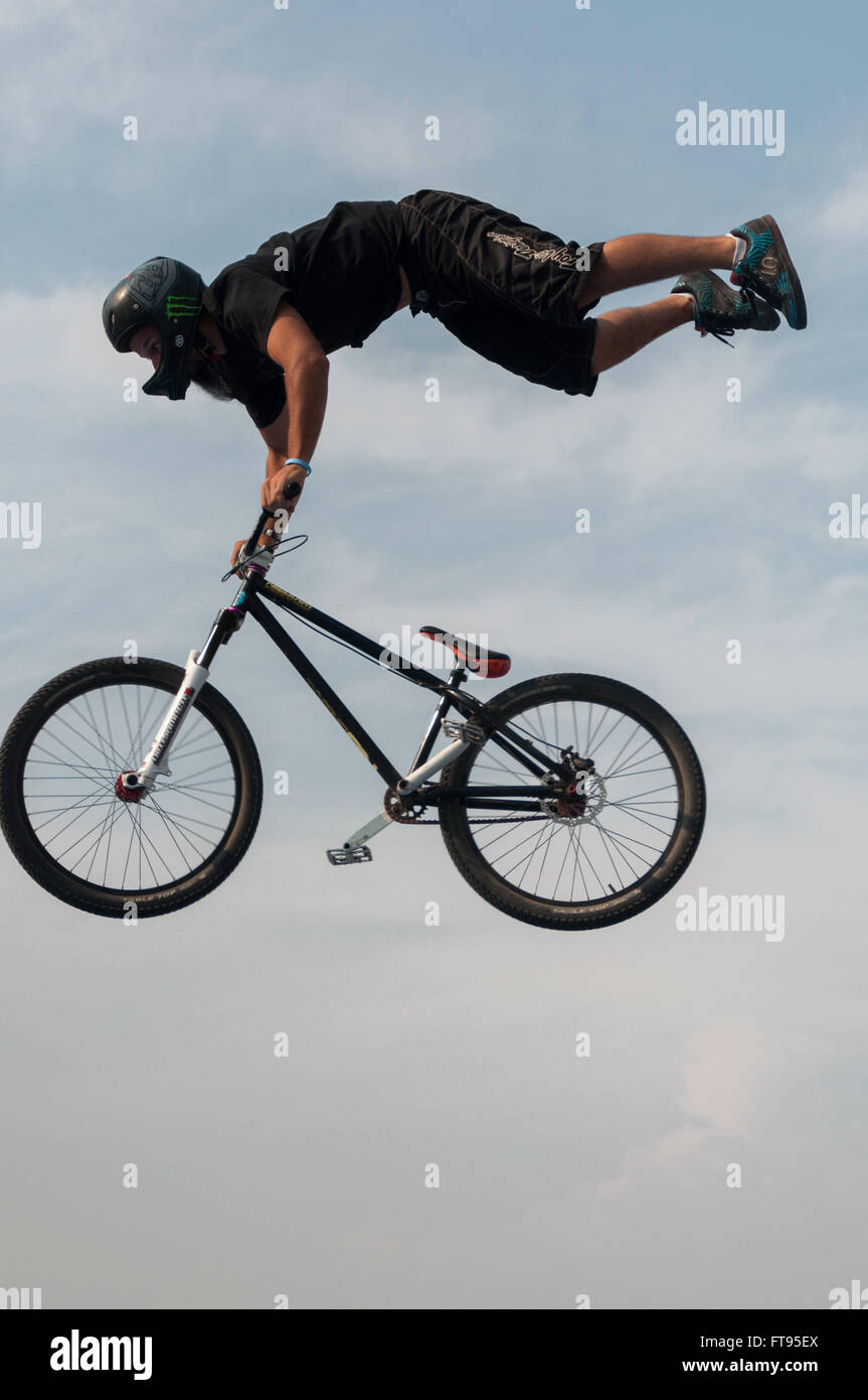 BMX biker in midair performing dirt jumping Stock Photo Alamy