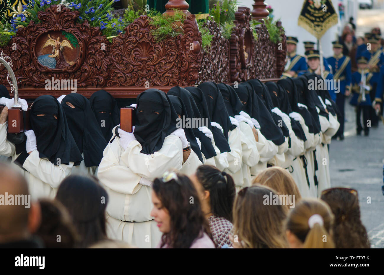 Mijas, Andalusia, Spain. 25 march 2016. Penitents carrying the float. Good Friday procession in Andalusian white village of Mijas, Malaga Province. Credit:  Perry van Munster/ Alamy Live News Stock Photo