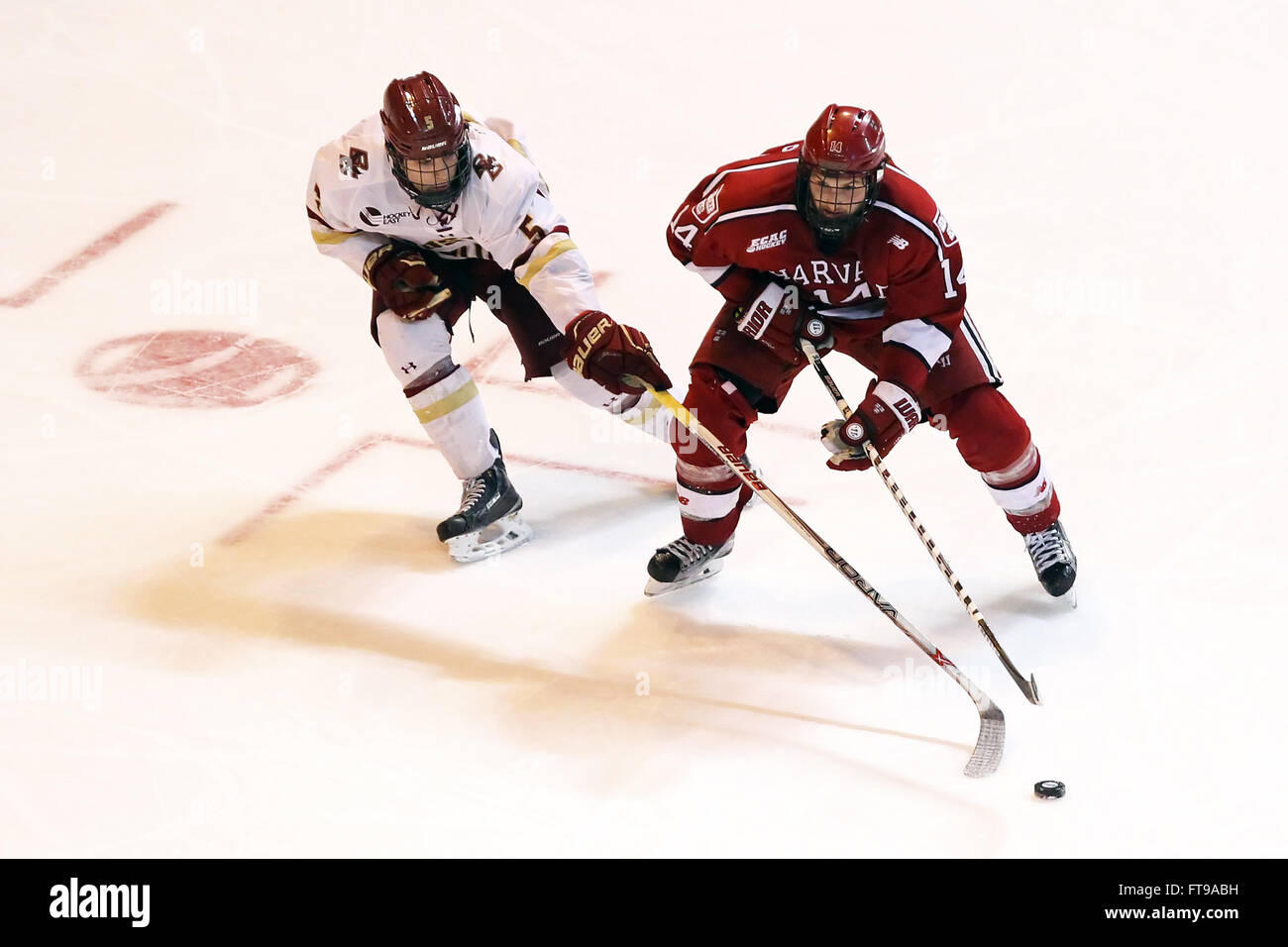 March 25, 2016; Worcester, MA, USA; Harvard Crimson forward Alexander Kerfoot (14) and Boston College Eagles defenseman Casey Fitzgerald (5) in action during the first round of the Northeast Regional NCAA hockey game between Harvard Crimson and Boston College Eagles at the DCU Center. Boston College defeated Harvard 4-1. Anthony Nesmith/Cal Sport Media Stock Photo