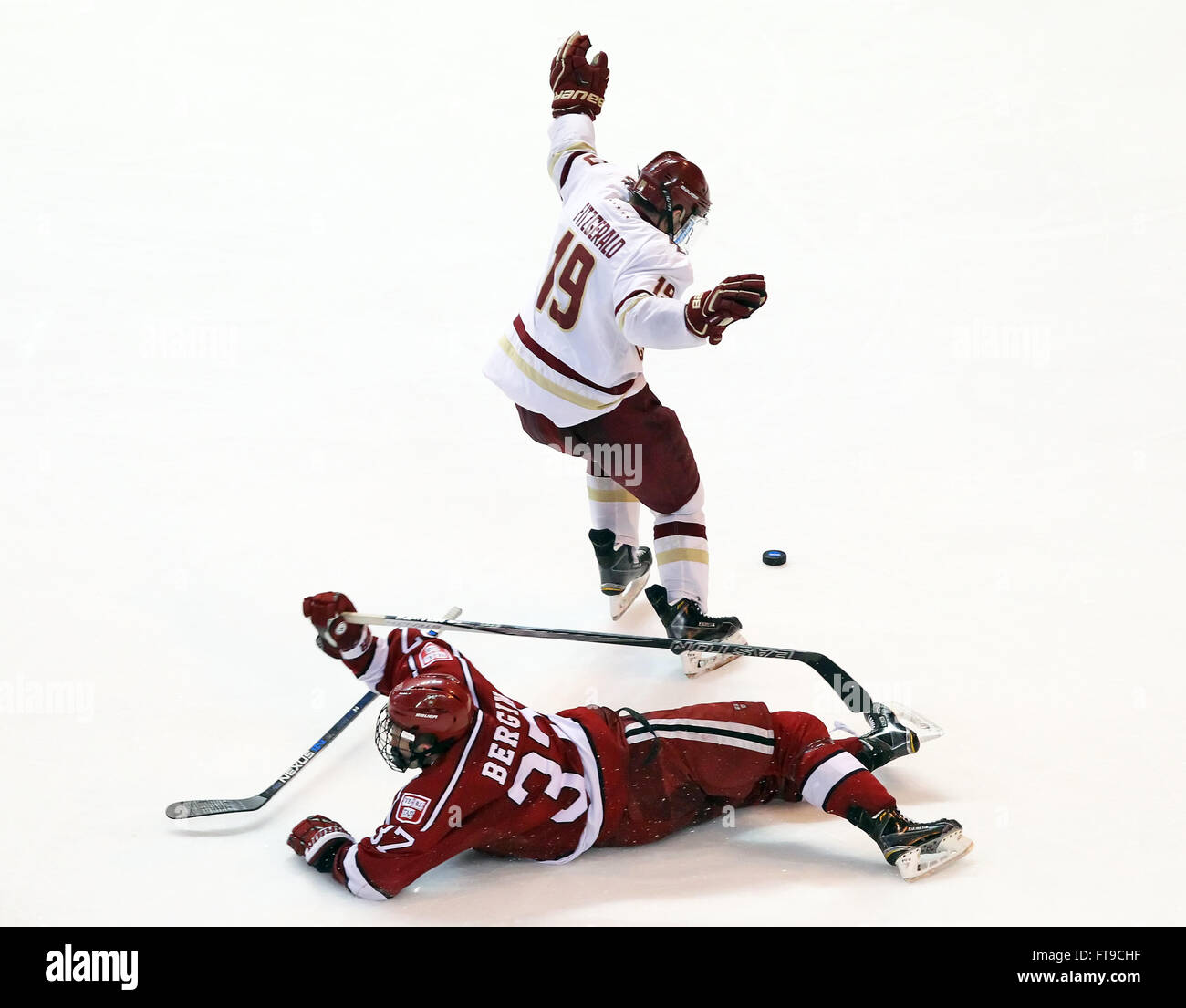 Worcester, Maine, USA. 25th Mar, 2016. ; Worcester, MA, USA; Harvard Crimson defenseman Desmond Bergin (37) reacts after being tripped by Boston College Eagles forward Ryan Fitzgerald (19) during the first round of the Northeast Regional NCAA hockey game between Harvard Crimson and Boston College Eagles at the DCU Center. Boston College defeated Harvard 4-1. Anthony Nesmith/Cal Sport Media Credit:  Cal Sport Media/Alamy Live News Stock Photo
