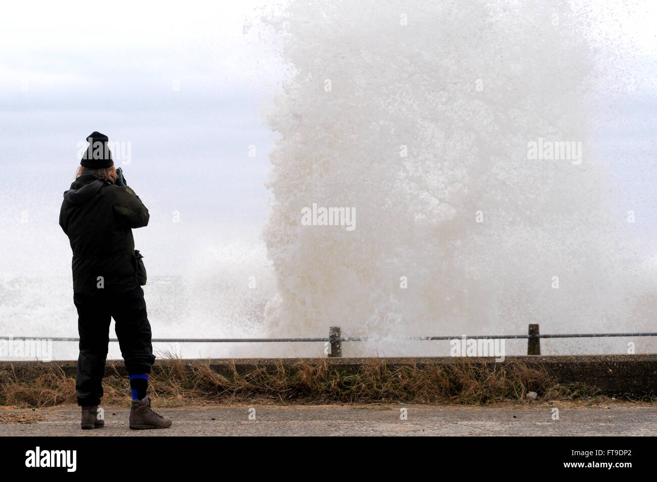 Newhaven, East Sussex, UK.26 March 2016.Windy weather arrives on the South coast. Photographer captures wave. . Stock Photo