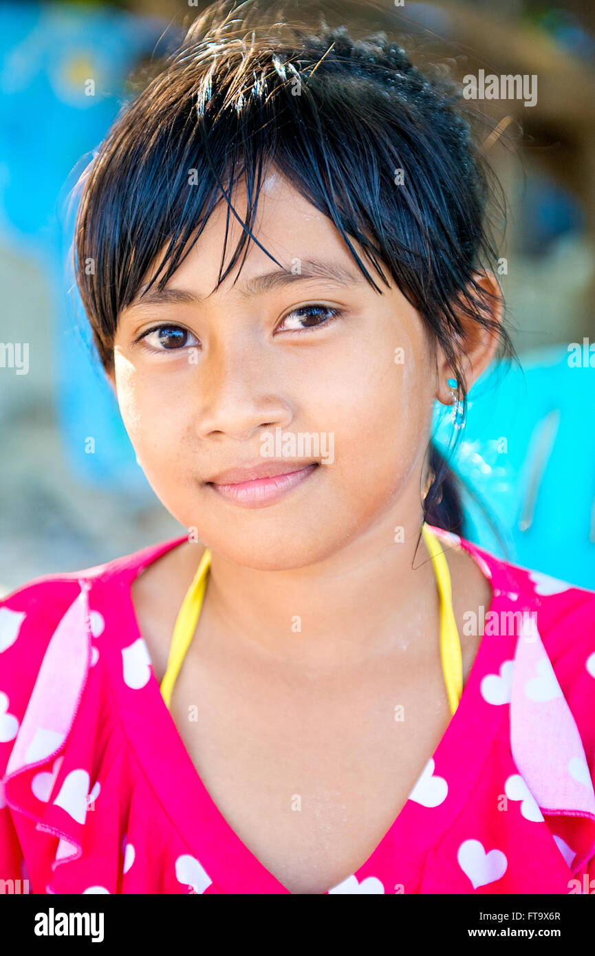 Pretty young Asian Thai girl smiling with beautiful eyes on the beach, Island of Koh Samet, Thailand, South East Asia. Stock Photo