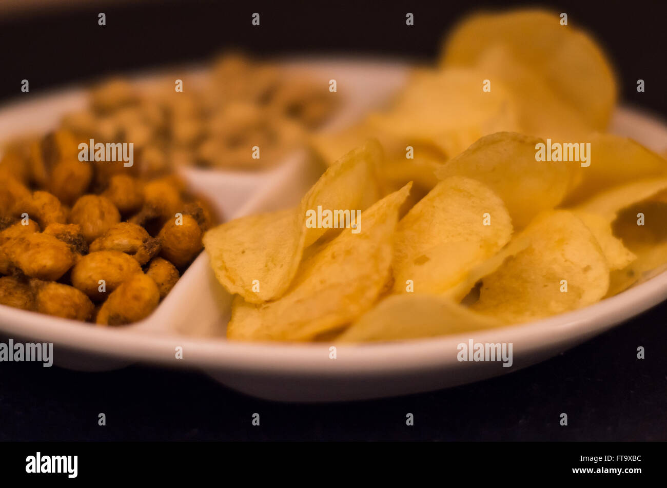 Chips and nuts cocktail martini snack Stock Photo Alamy